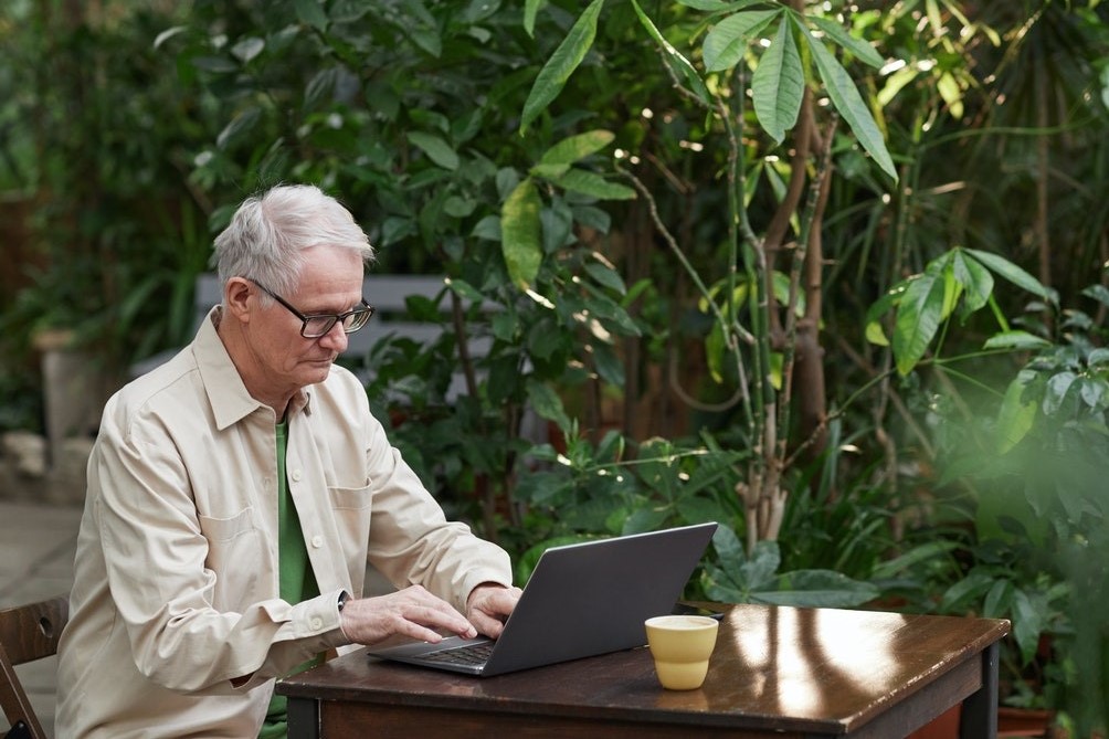 man on his laptop outside