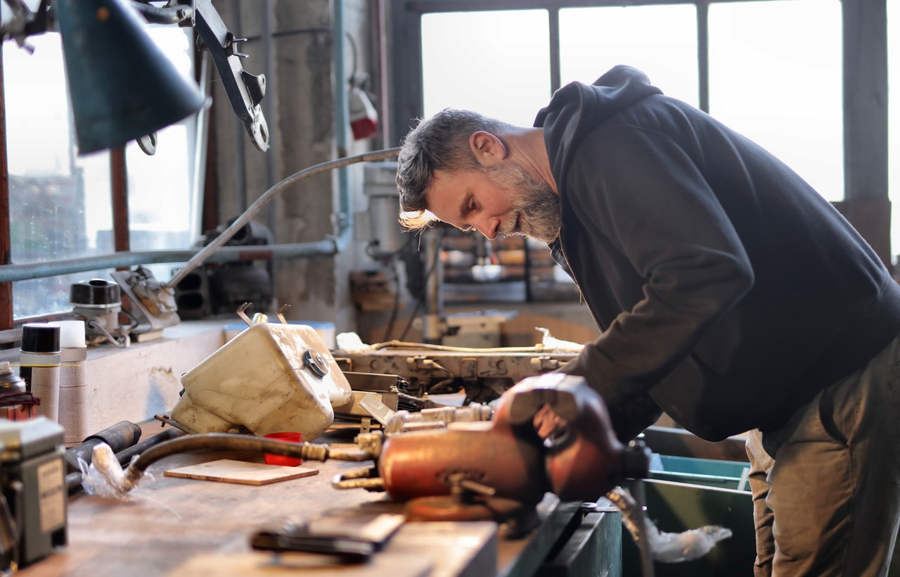 small business owner at his workbench